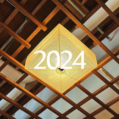 A photo of a lamp with the text 2024 superimposed on top