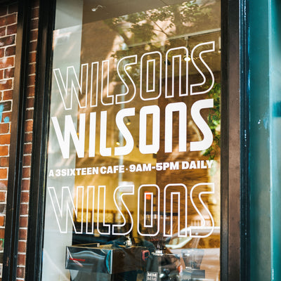 A photo of a window with Wilsons graphics on it.