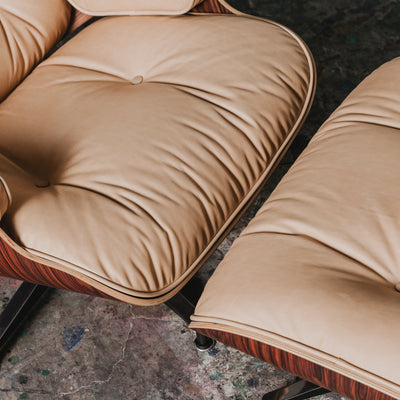 A close up shot of vegetable tanned leather upholstery on an Eames lounge chair.