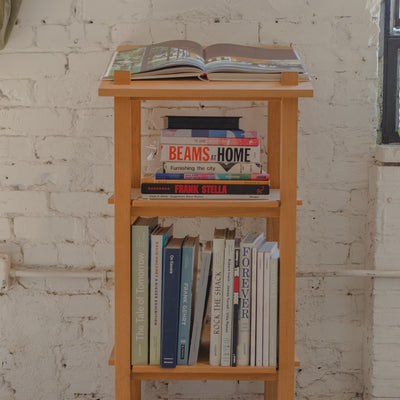 Our wood lectern with various art books on it.