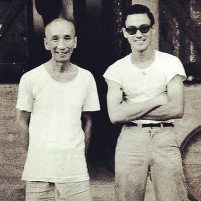 Ip Man and Bruce Lee in white tees.
