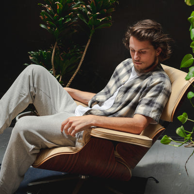 A man in a lounge chair leans back.