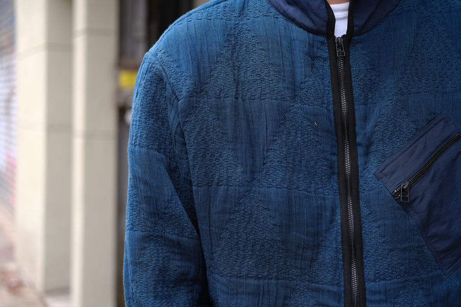 A detailed shot of the indigo dyed fabric on the jacket.