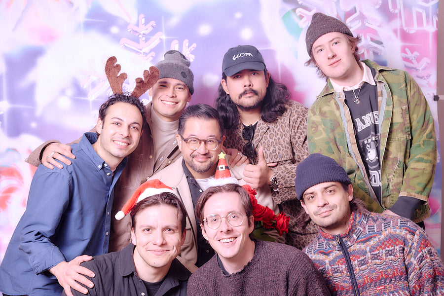 A bunch guys in a cheesy mall photo.