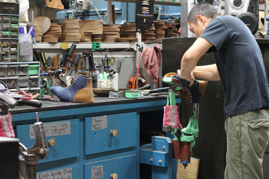 Our Navy Latigo and Copper Task workboot on a bench.