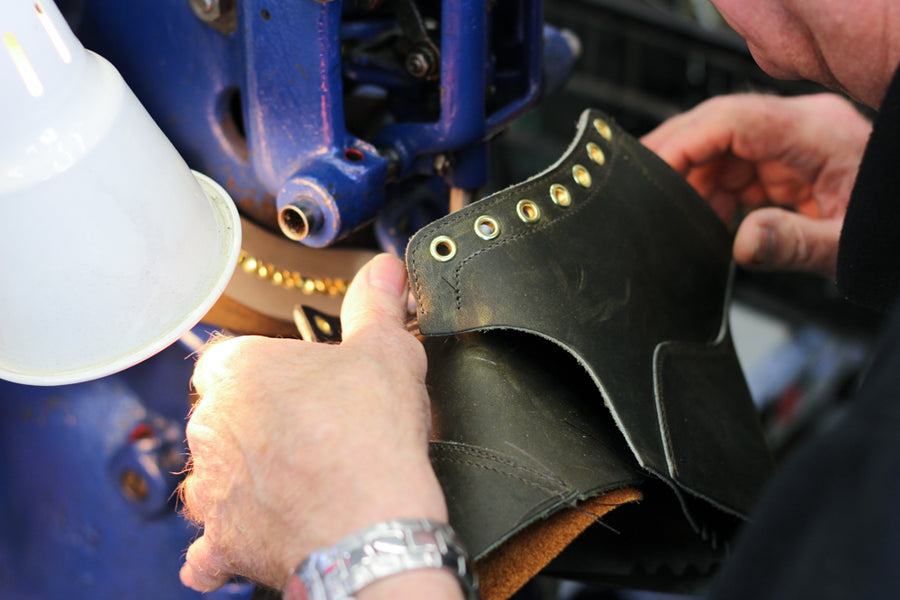 Skilled hands sew the boot uppers one at a time.