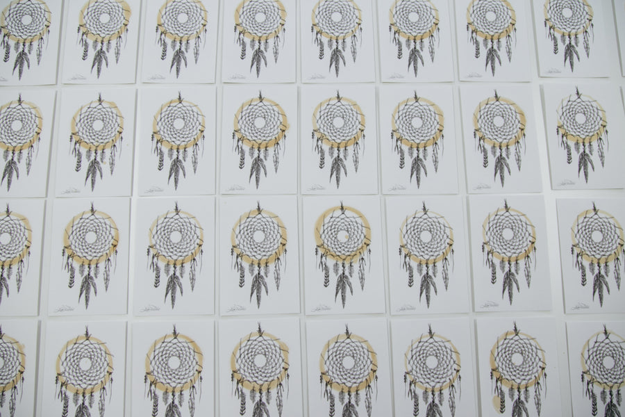 Photo of the coffee-stain dreamcatcher prints hung up in the 3sixteen store.