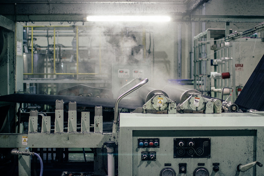 Warp threads are steamed and starched to prepare them for the shuttle loom.