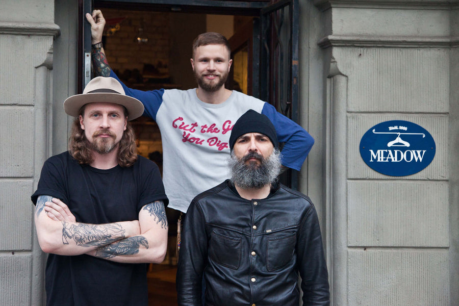 Christopher, Peter, and Apostolos standing in front of Meadow