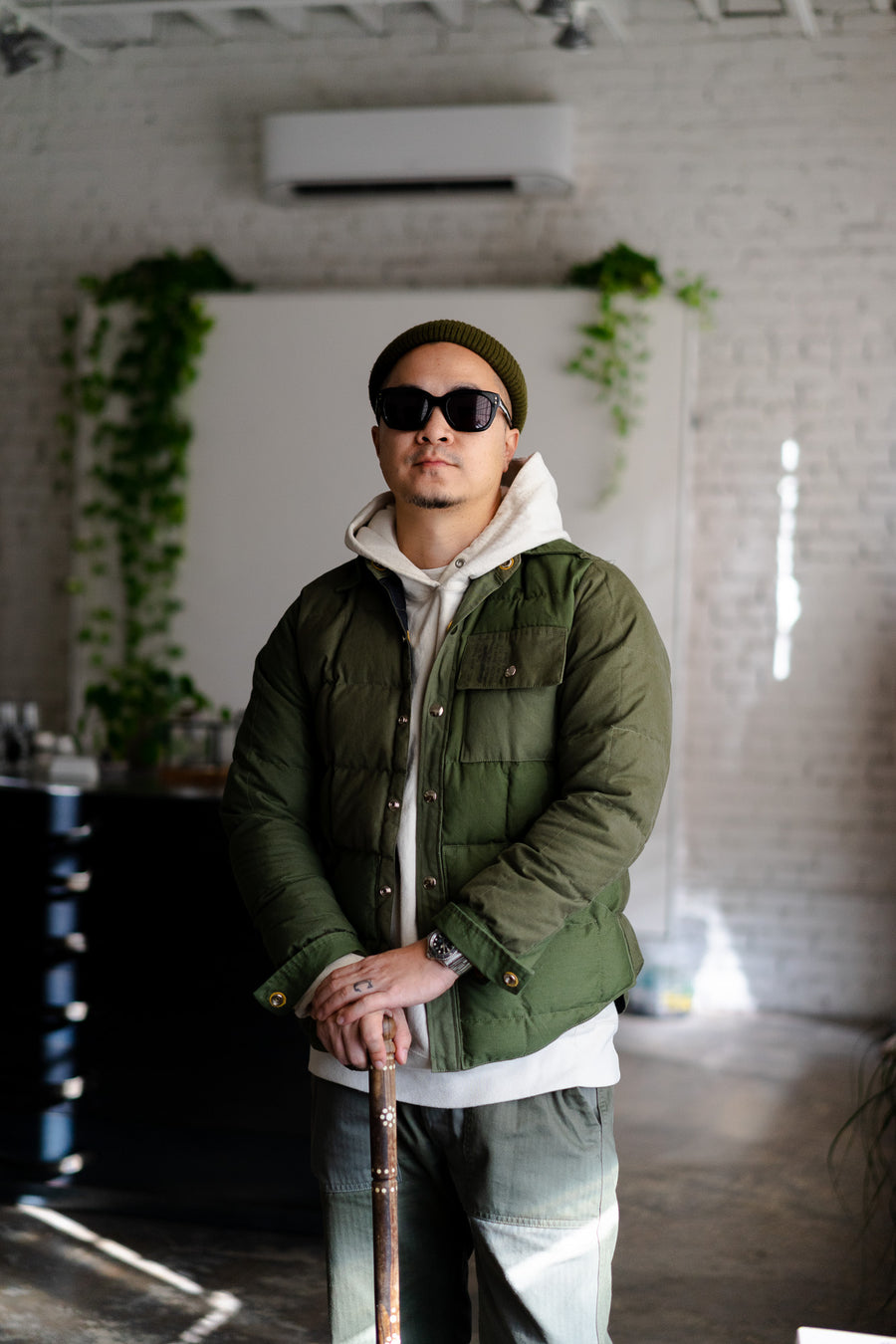 A man in sunglasses and a cane.