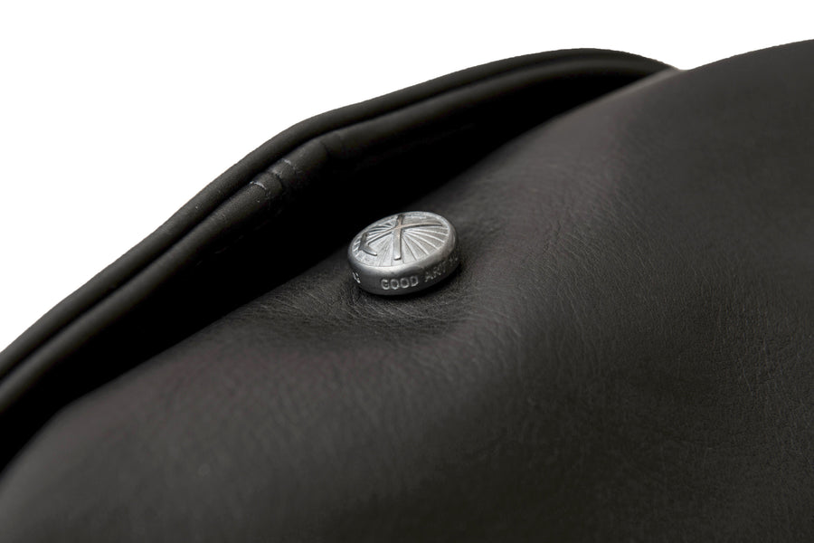 Close view of the sterling silver snap by good art on jacket.