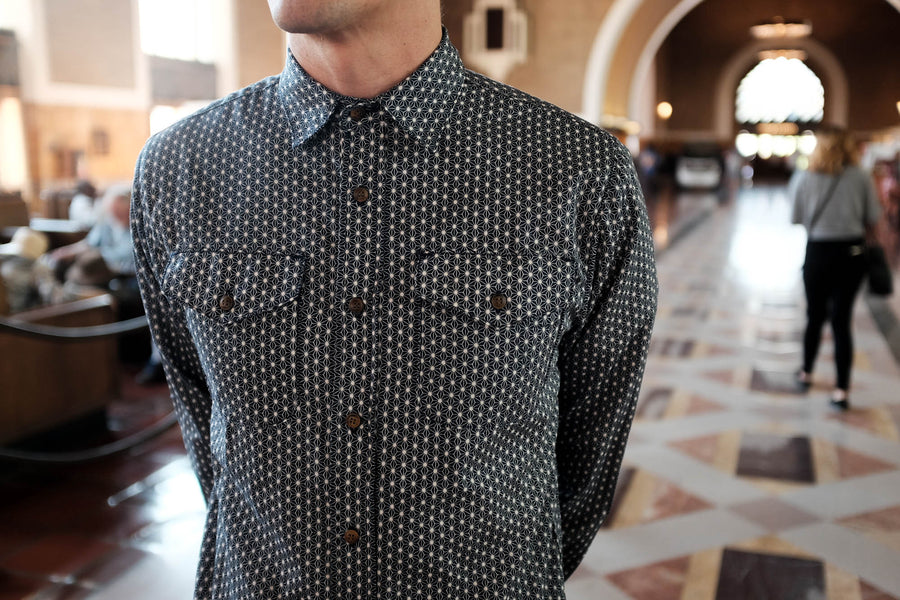 Model shown wearing the Asanoha Workshirt in Navy with white print.