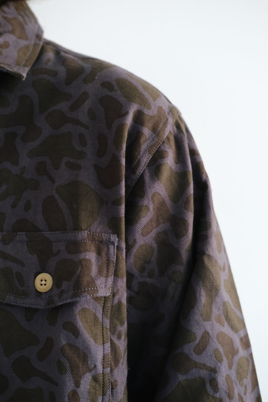 A detail shot of the various Arp-inspired shapes on the shirt.