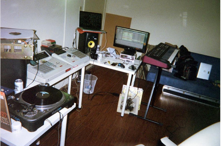 A film photo of walterwarm's beatmaking setup including several MPC's, studio monitors, a turntable and a keyboard.