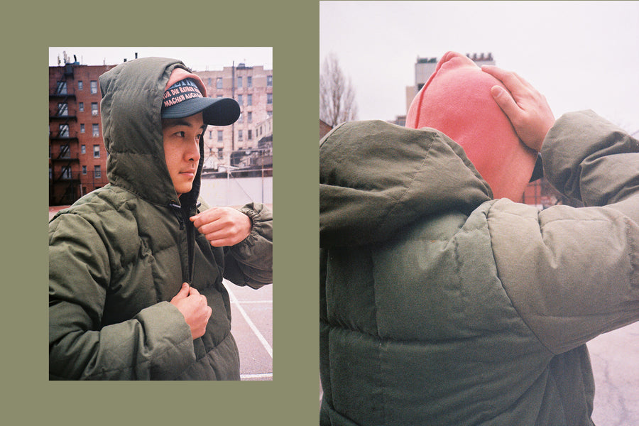 A diptych of a young man wearing the down jacket with paint splattered fatigues.
