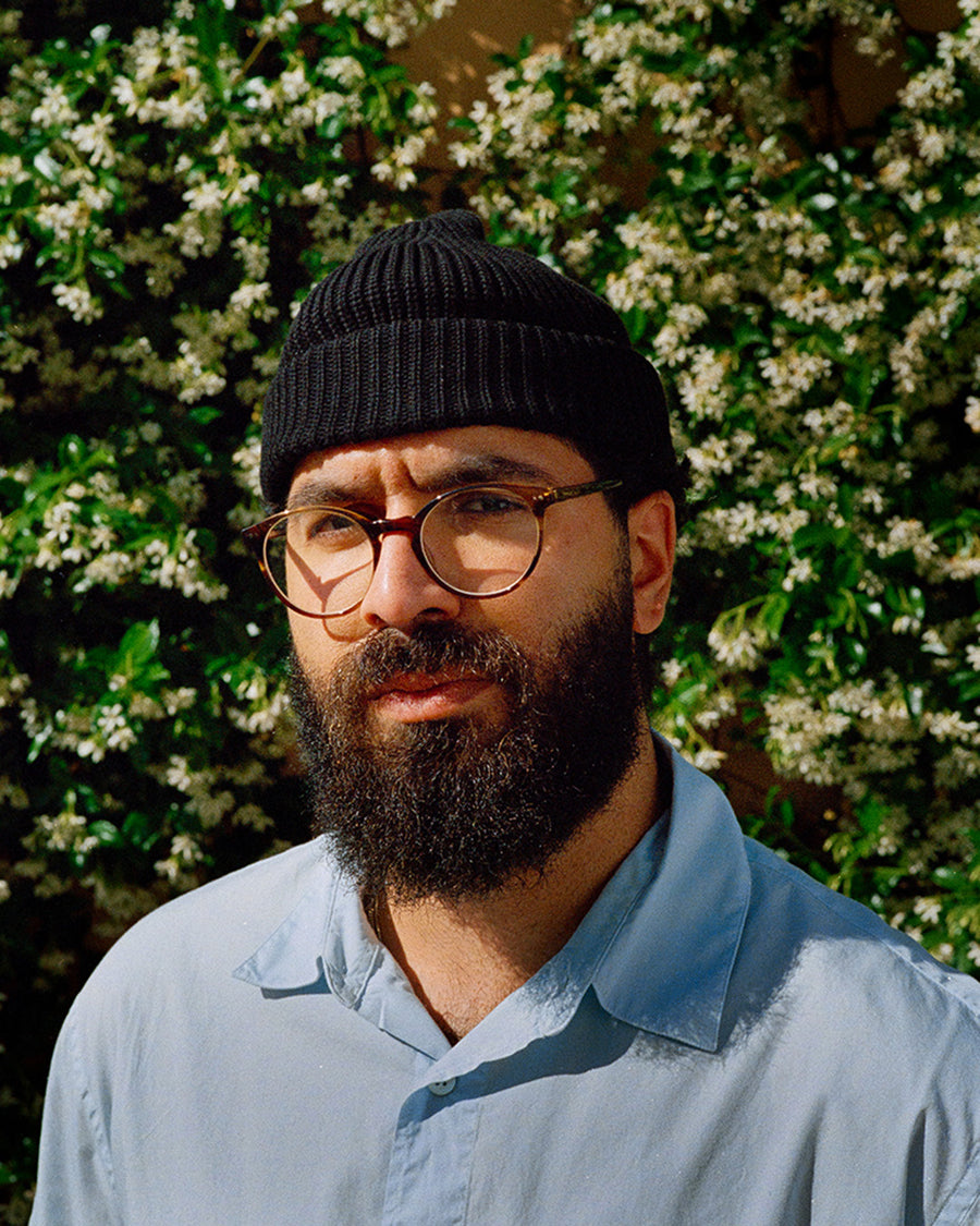A portrait of a bearded man.