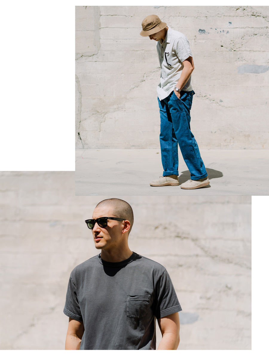 A diptych of a man in indigo pants and a charcoal tee.
