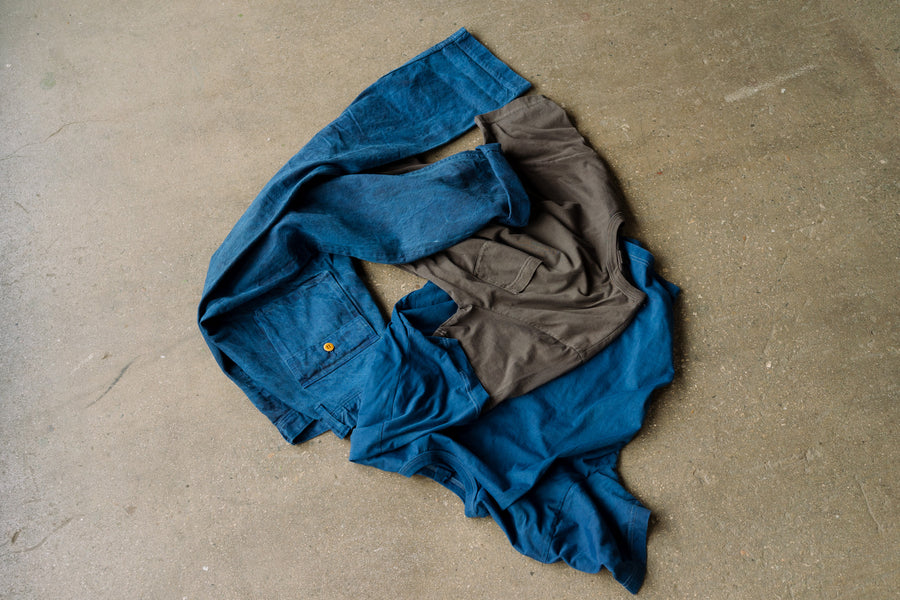 A pile of blue and black clothes.
