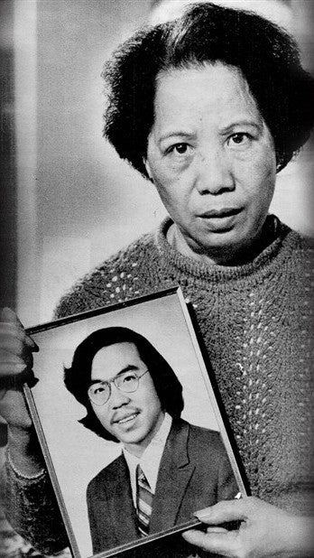 Lily Chin, Vincent's mother, holds a photograph of her dead son.