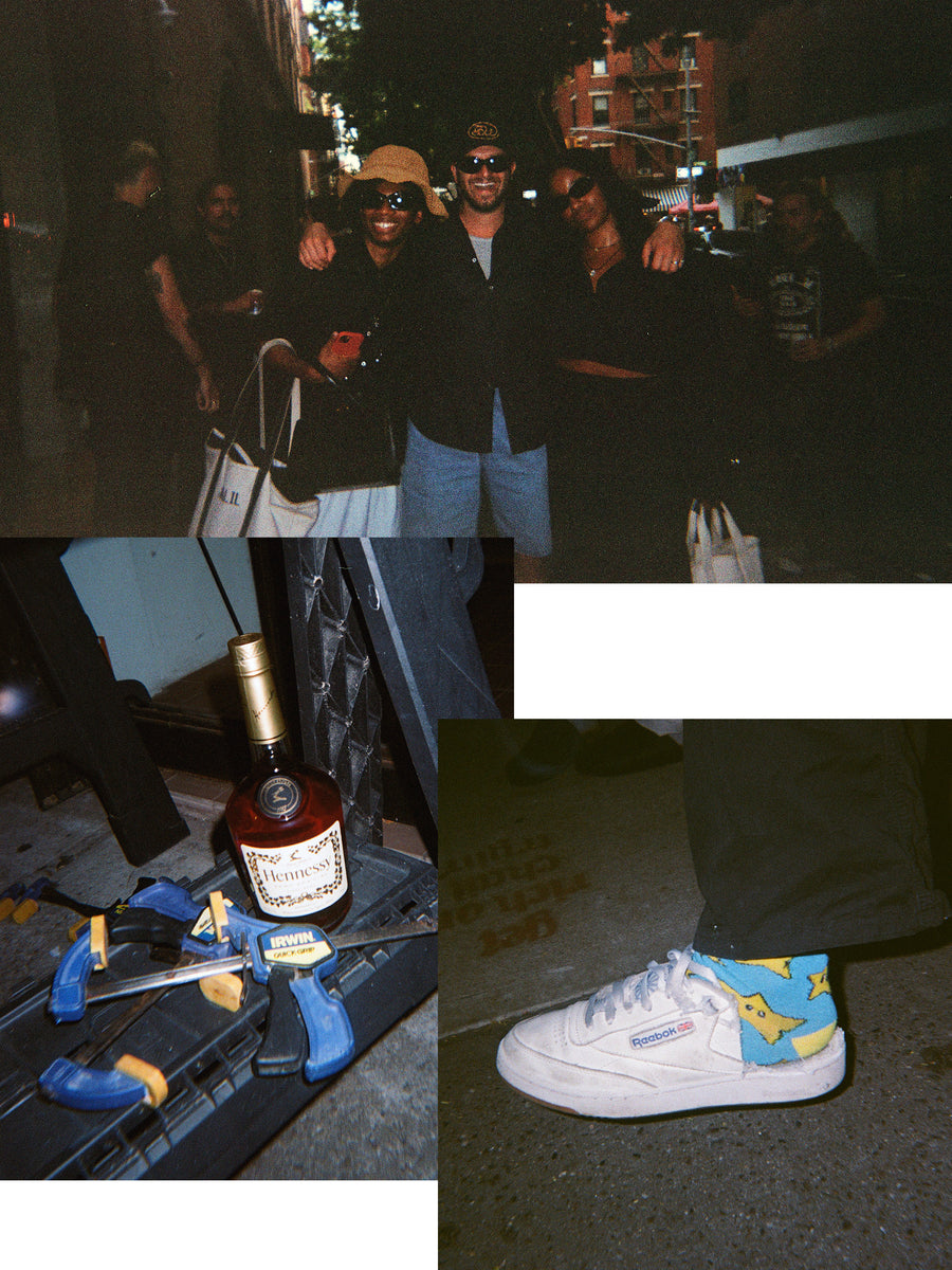 Some friends standing outside at a party, and a bottle of Hennessy on a saw horse.