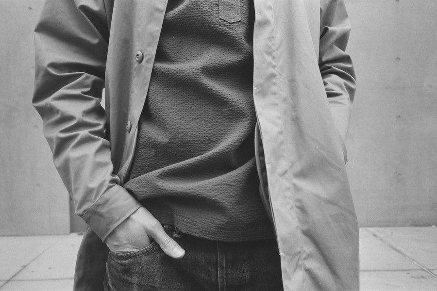 A photo showcasing the different textures between the seersucker and the water resistant twill.