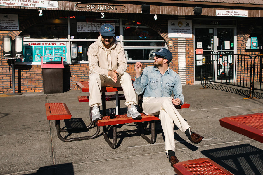Two grown dirtbags in white fatigue pants.