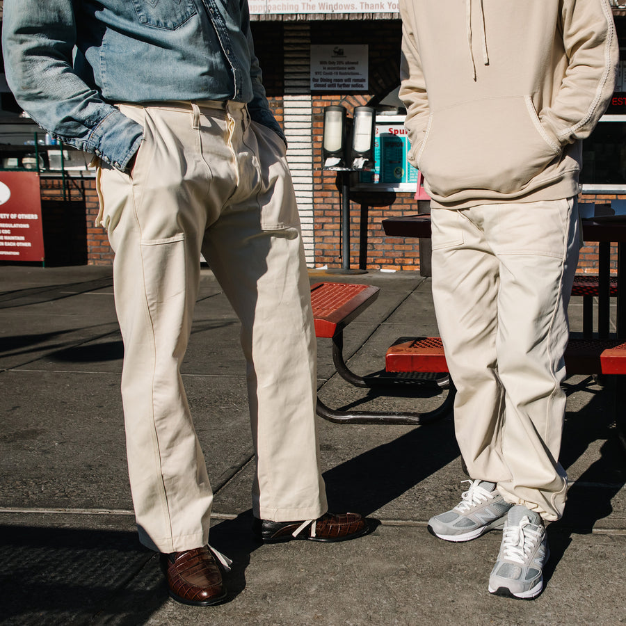 Two guys in white pants.