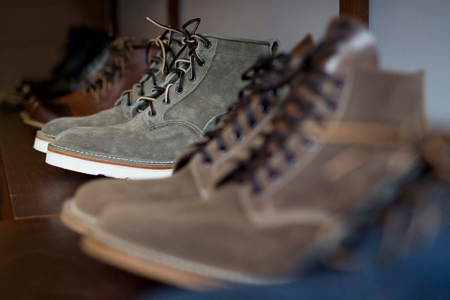 Close up view of boots on display.