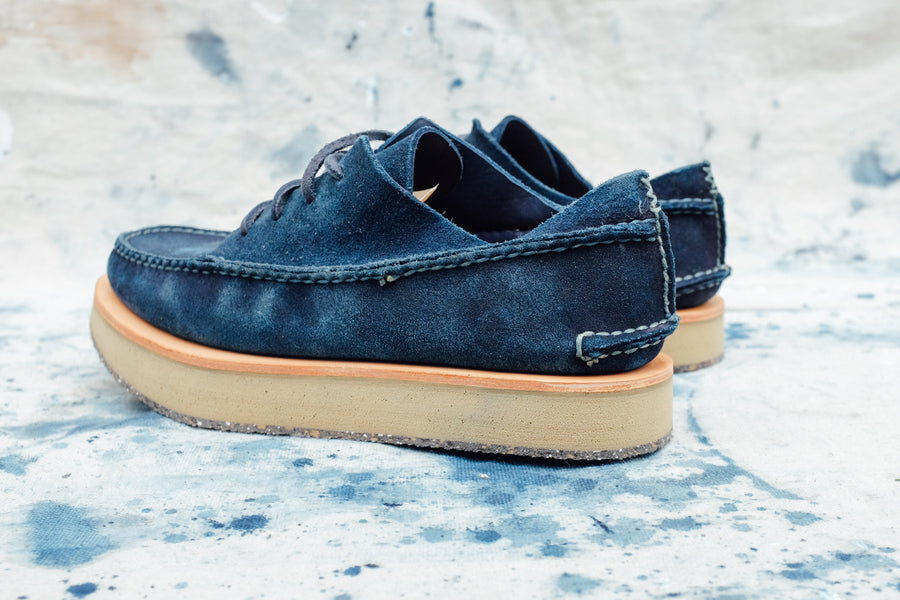 A back view of the indigo moccasins unworn.