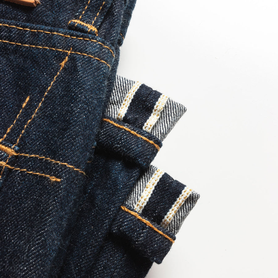 An up close image of the gold selvedge detail on the jeans.