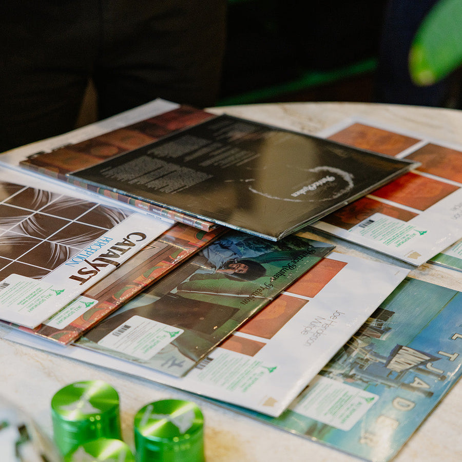 A selection of records on a marble table.