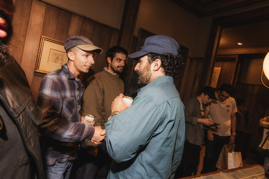 A group of guys chatting in a room.