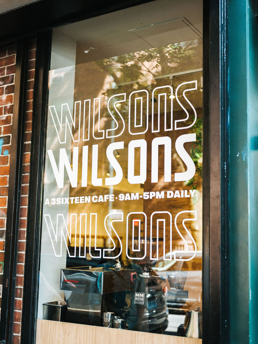 A photo of a window with Wilsons graphics on it.
