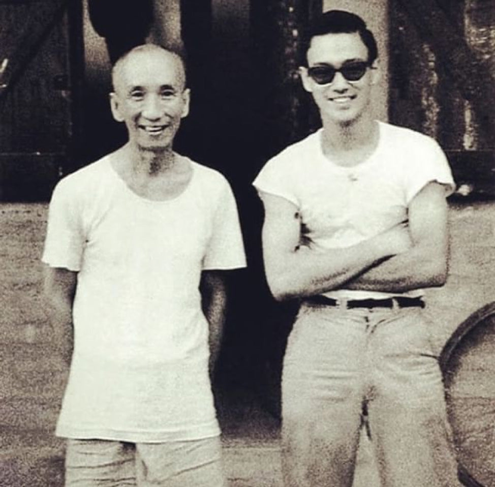 Ip Man and Bruce Lee in white tees.