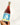 A bottle of wine held up against a white background.