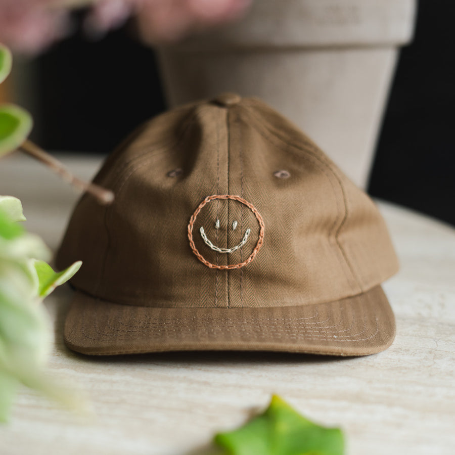 Smiley Caps by Jaime Wong.