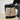 A man holds a tan tote bag.