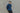The model wears the deep indigo 3sixteen chambray and leans against a wall with his arms around his back.