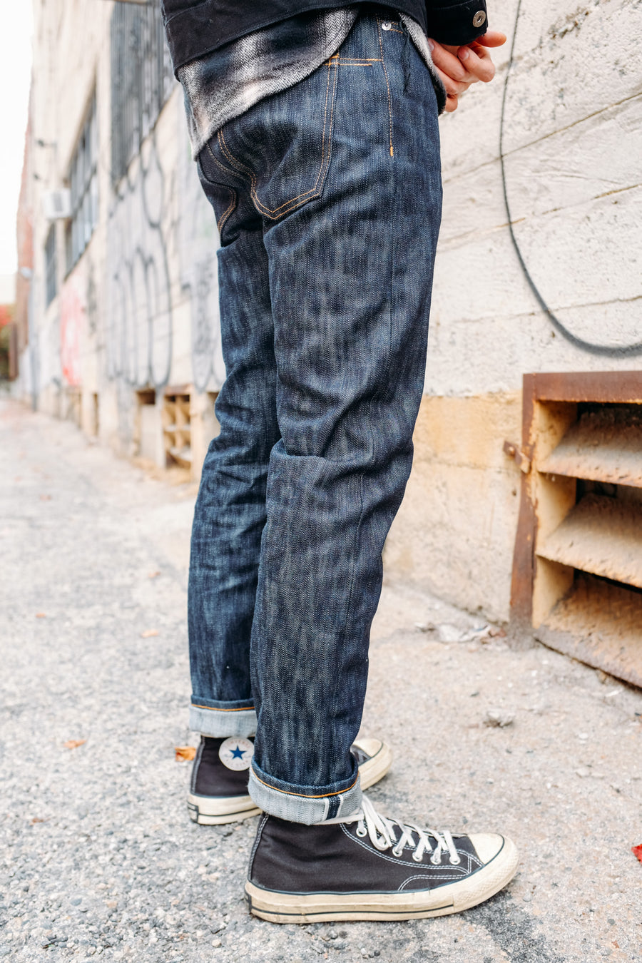 A model shows off a rear 3/4 view of the 3sixteen 15y denim in the new NT fit.
