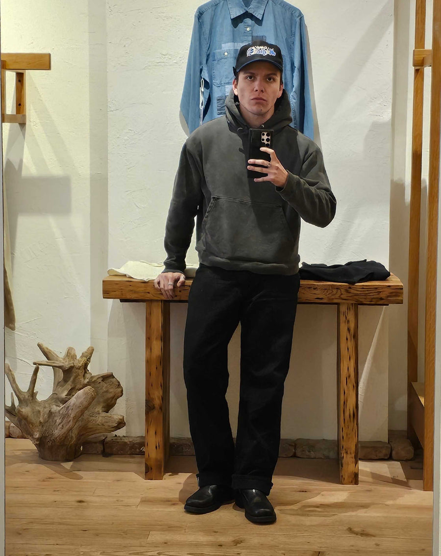 A man takes a mirror selfie.