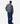 Person wearing a plaid shirt and blue pants on a white background