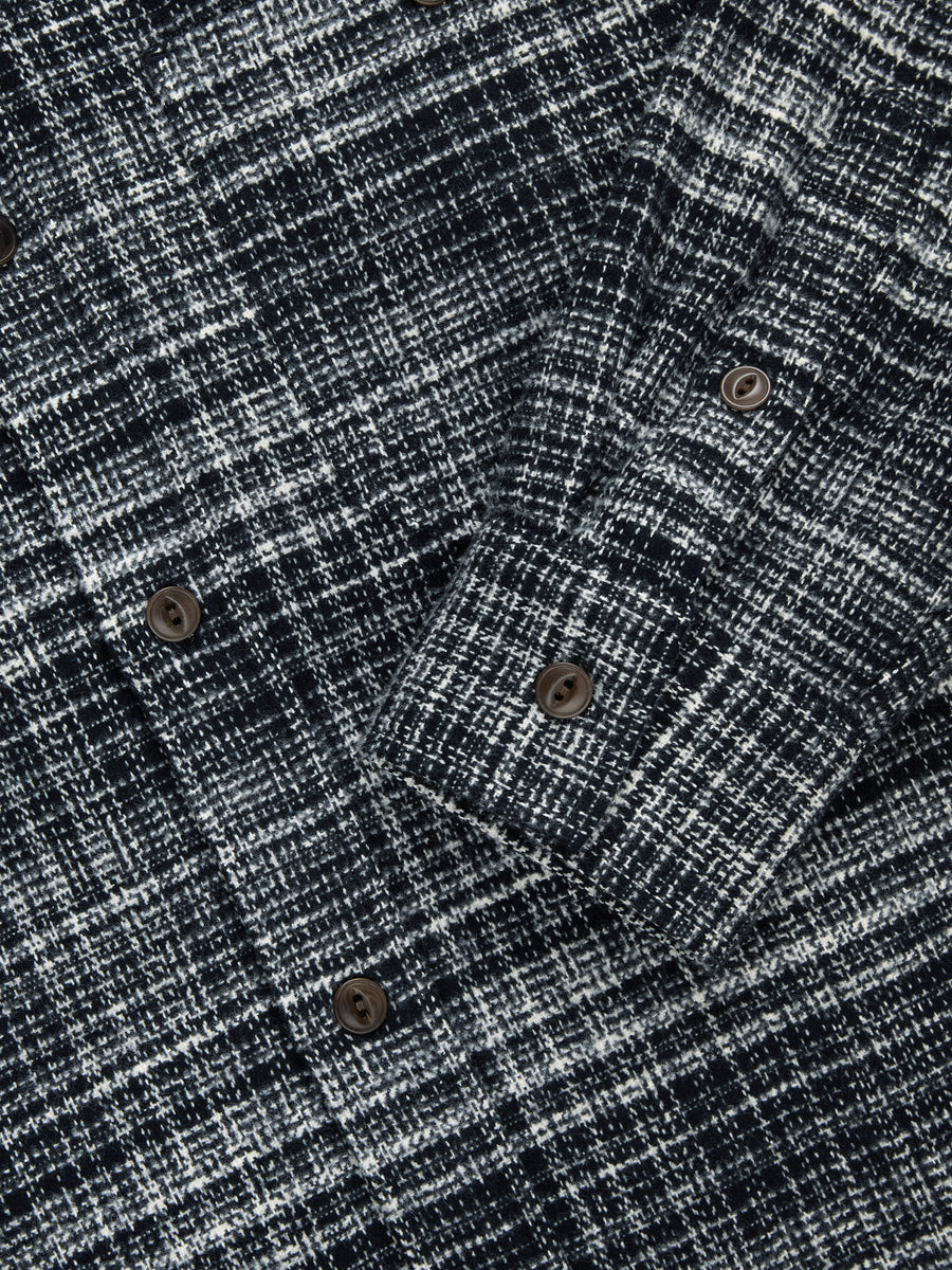 Close-up of a textured fabric with button details