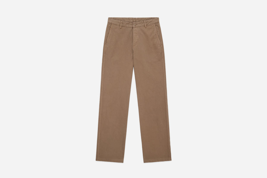 A pair of beige, wide leg khaki twill work pants with high rise, flat-fell seams, and corozo buttons.