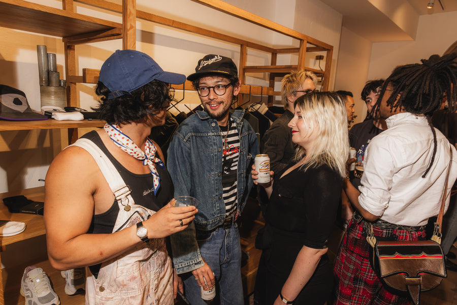 Some people chatting over drinks at a party.