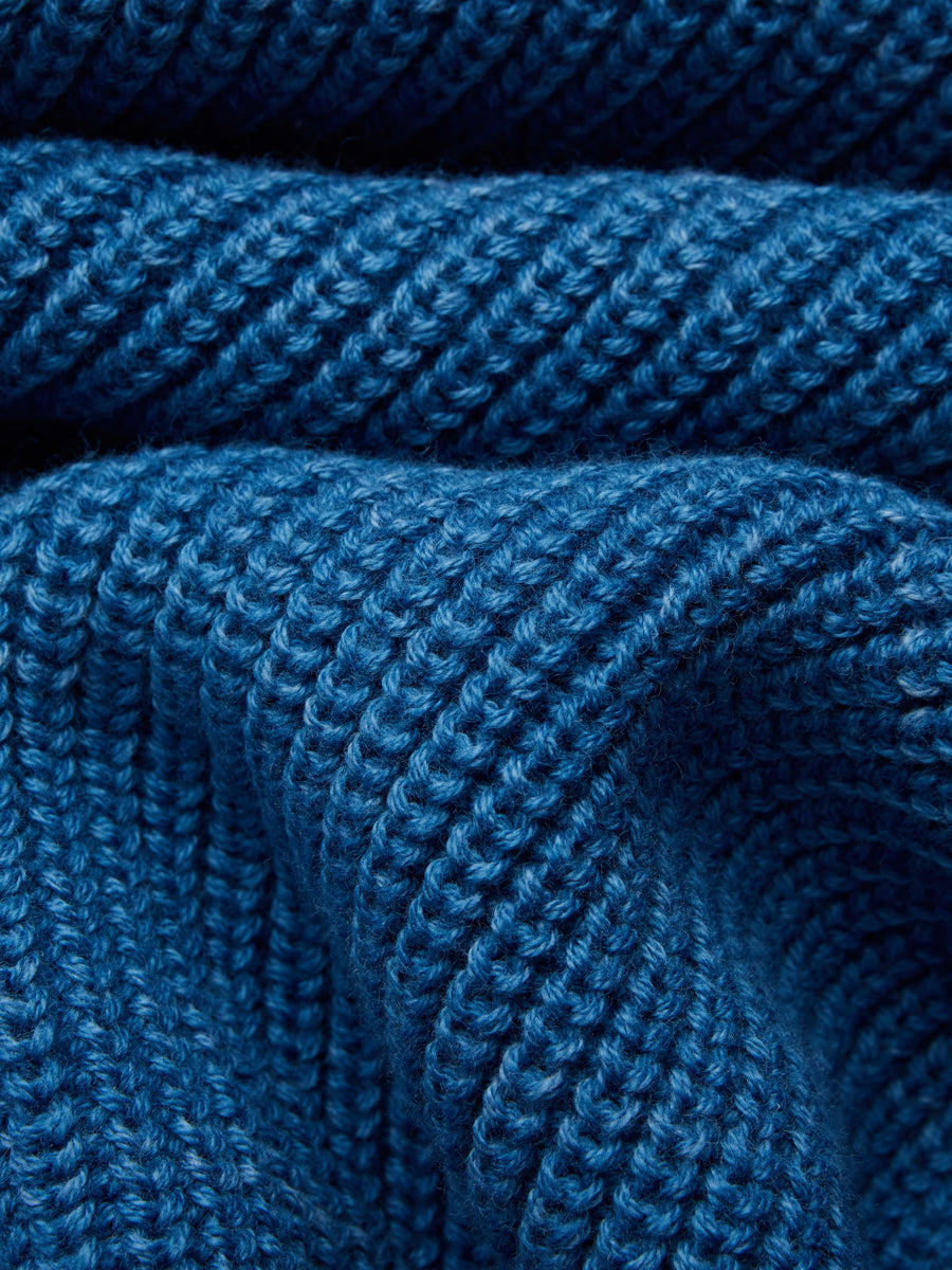 Close-up of a blue knitted fabric texture