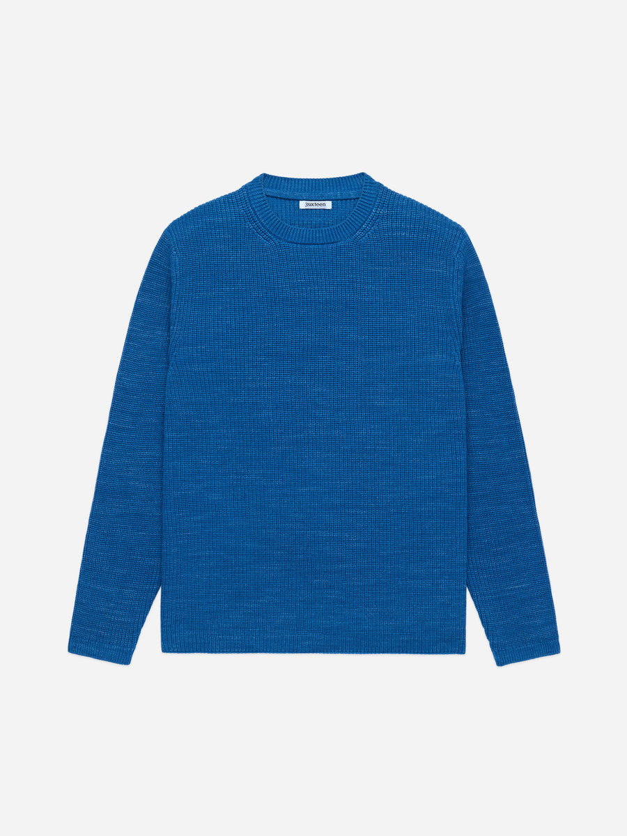 Blue sweater on a light gray background