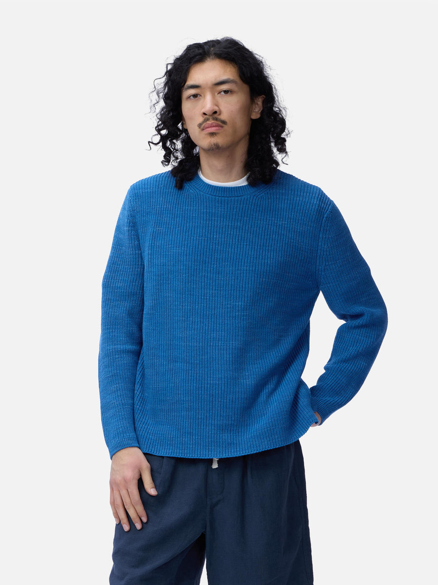 Man wearing a blue sweater on a white background