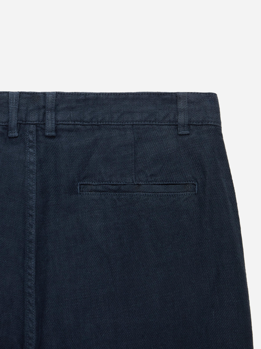 Navy blue pants with a pocket on a white background