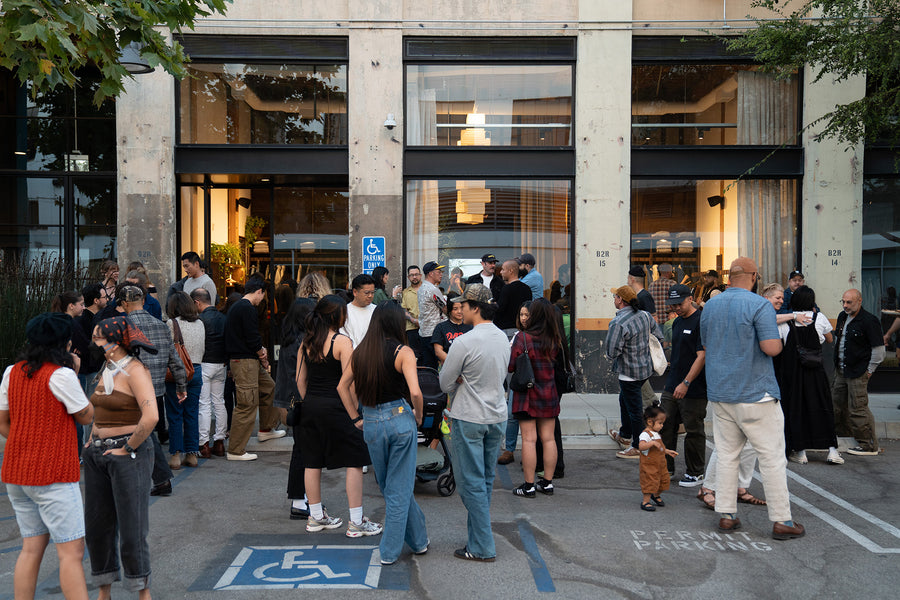 A big crowd of people hanging out outside the 3sixteen LA store.