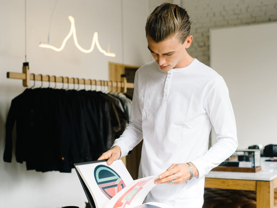 Man wearing white henley.